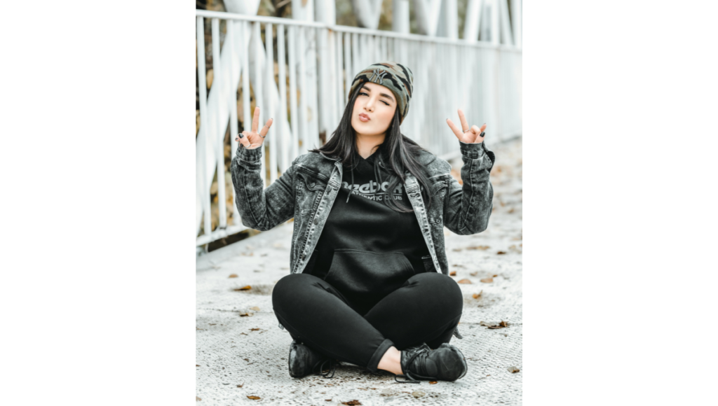 Denim jacket layered over hoodie winter street style look under 3000
