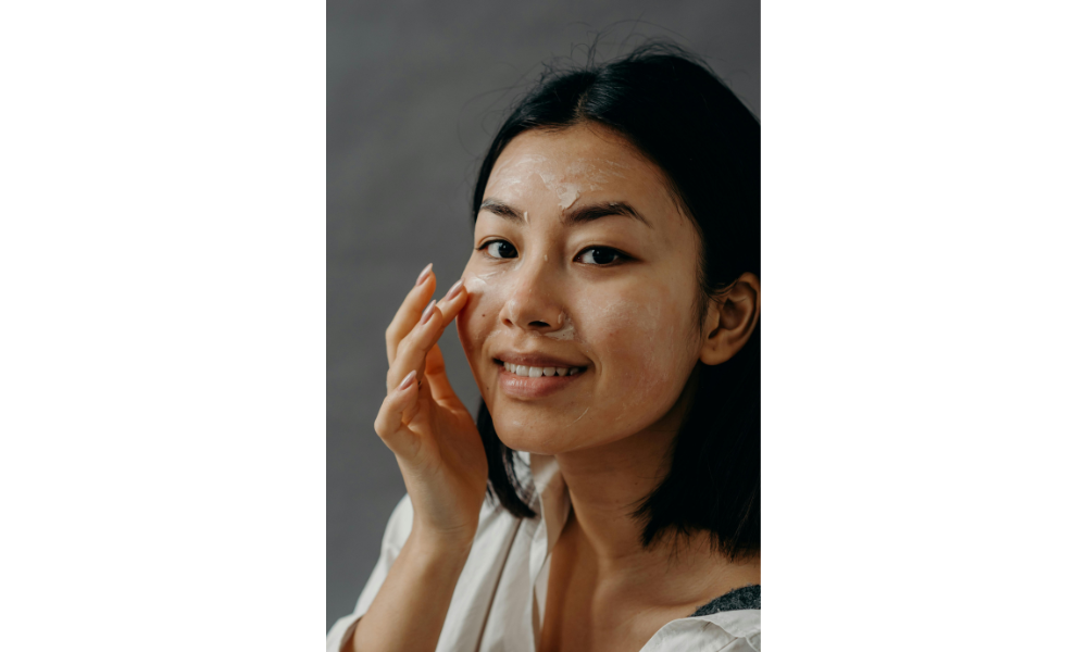 Applying sunscreen for oily skin as part of a daily skincare routine in India